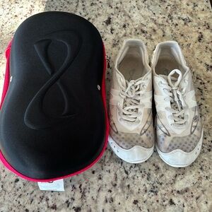 White NFINITY cheer shoes with carry case and tag